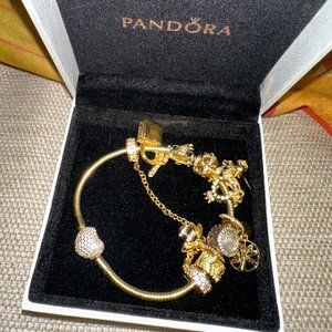 beautiful pandora bracelet in gold with charms